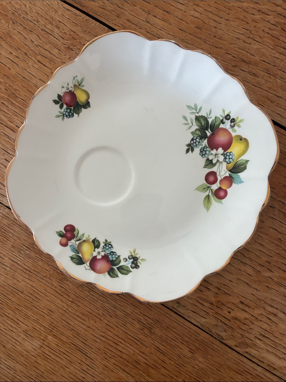 White Porcelain Saucer with Fruit Motif and Gold Trim
